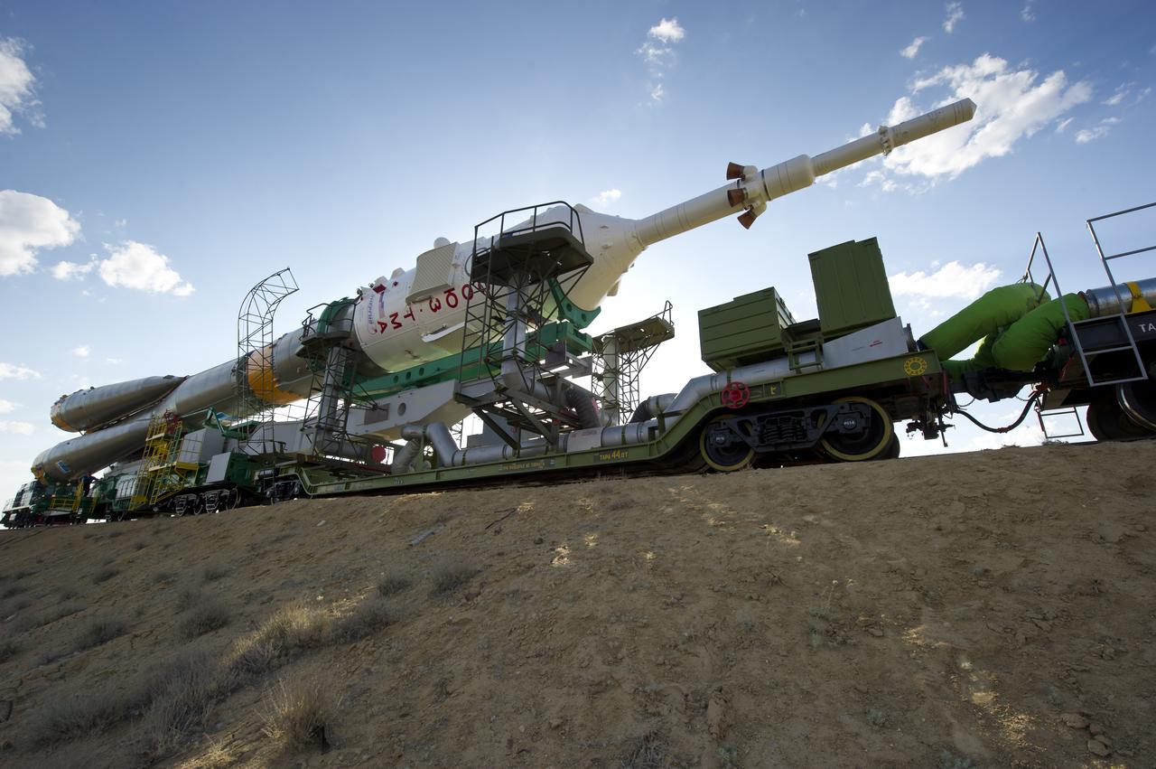 The Soyuz TMA-02M spacecraft is rolled out by train on its way to the launch pad at the Baikonur Cosmodrome, Kazakhstan, Sunday, June 5, 2011.  The launch of the Soyuz spacecraft with Expedition 28 Soyuz Commander Sergei Volkov of Russia, NASA Flight Engineer Mike Fossum and JAXA (Japan Aerospace Exploration Agency) Flight Engineer Satoshi Furukawa is scheduled for 2:15 a.m. local time on Wednesday, June 8, 2011.  Photo Credit (NASA/Carla Cioffi)
