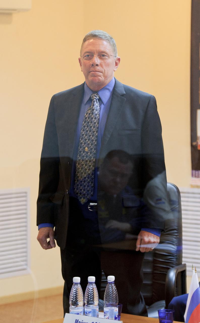 Expedition 28 NASA Flight Engineer Mike Fossum stands during the State Commission meeting to approve the Soyuz launch of Expedition 28 to the International Space Station, Monday, June 6, 2011, at the Cosmonaut Hotel in Baikonur, Kazakhstan. The mission is set to launch on Tuesday, June 8, from the Baikonur Cosmodrome. Photo Credit: (NASA/Carla Cioffi)