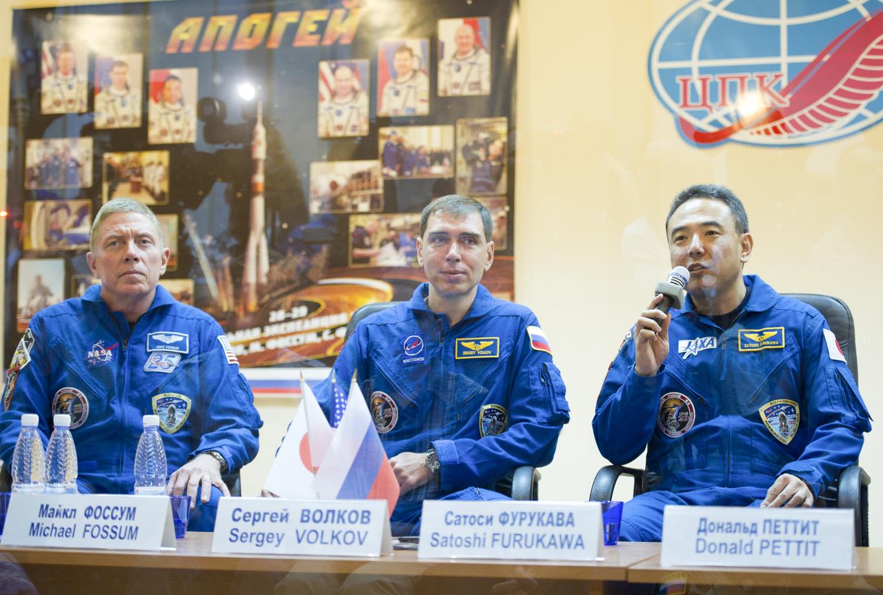 Expedition 28 Japan Aerospace Exploration Agency (JAXA) Flight Engineer Satoshi Furukawa, right, speaks as NASA Flight Engineer Mike Fossum, left, and Soyuz Commander Sergei Volkov of Russia look on during a press conference, Monday, June 6, 2011, at the Cosmonaut Hotel in Baikonur, Kazakhstan. The mission is set to launch on Tuesday, June 8, from the Baikonur Cosmodrome. Photo Credit: (NASA/Carla Cioffi)