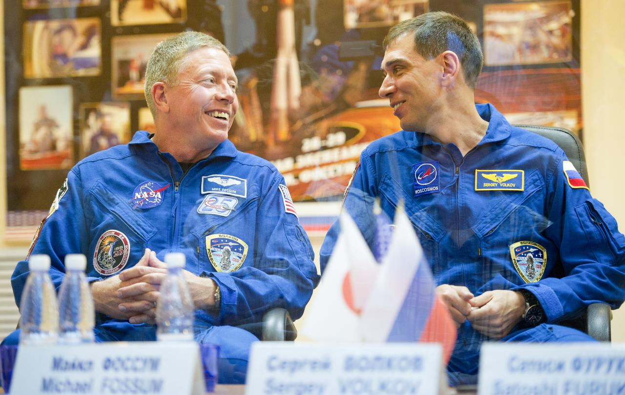 Expedition 28 NASA Flight Engineer Mike Fossum, left, and Soyuz Commander Sergei Volkov of Russia share a laugh during a press conference, Monday, June 6, 2011, at the Cosmonaut Hotel in Baikonur, Kazakhstan. The mission is set to launch on Tuesday, June 8, from the Baikonur Cosmodrome. Photo Credit: (NASA/Carla Cioffi)