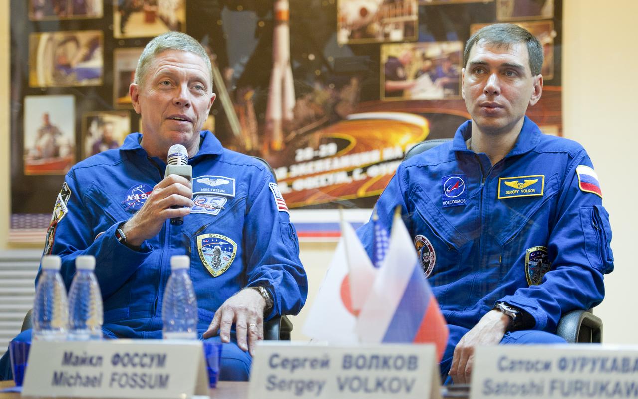 Expedition 28 NASA Flight Engineer Mike Fossum, left, and Soyuz Commander Sergei Volkov of Russia are seen during a press conference, Monday, June 6, 2011, at the Cosmonaut Hotel in Baikonur, Kazakhstan. The mission is set to launch on Tuesday, June 8, from the Baikonur Cosmodrome. Photo Credit: (NASA/Carla Cioffi)