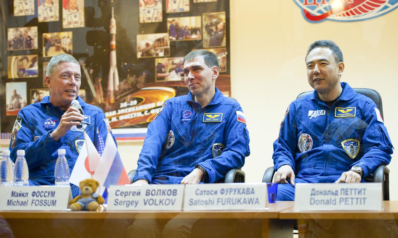 Expedition 28 NASA Flight Engineer Mike Fossum, left, Soyuz Commander Sergei Volkov and Japan Aerospace Exploration Agency (JAXA) Flight Engineer Satoshi Furukawa, right, are seen during a press conference at the Cosmonaut Hotel in Baikonur, Kazakhstan, Monday, June 6, 2011. The mission is set to launch on Tuesday, June 8, from the Baikonur Cosmodrome. Photo Credit: (NASA/Carla Cioffi)