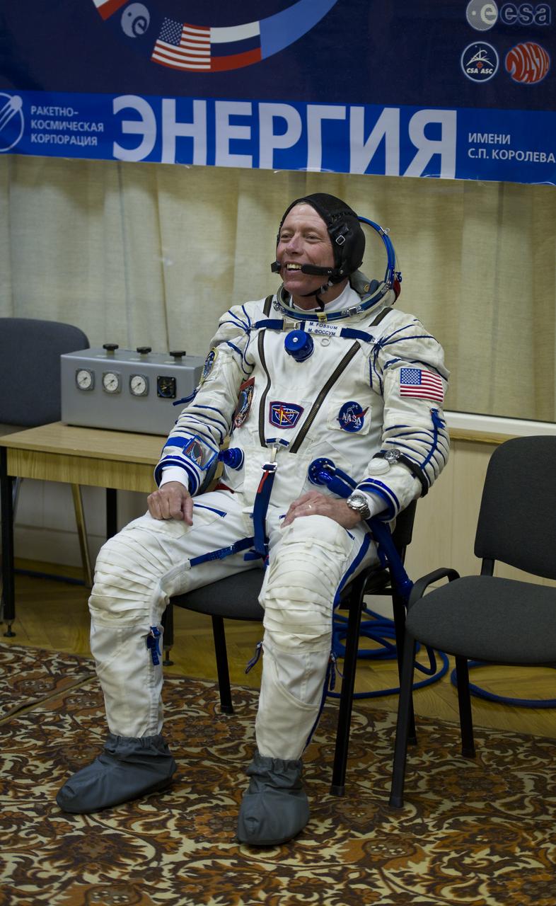 NASA astronaut and Expedition 28 Flight Engineer Mike Fossum awaits to have his Russian Sokol suit pressure checked in preparation for his launch onboard the Soyuz TMA-02M on Tuesday, June 7, 2011 at the Baikonur Cosmodrome in Kazakhstan.  The Soyuz spacecraft will carry Expedition 28 Soyuz Commander Sergei Volkov, JAXA (Japanese Aerospace Exploration Agency) Flight Engineer Satoshi Furukawa and Fossum to the International Space Station.  Photo Credit:  (NASA/Carla Cioffi)