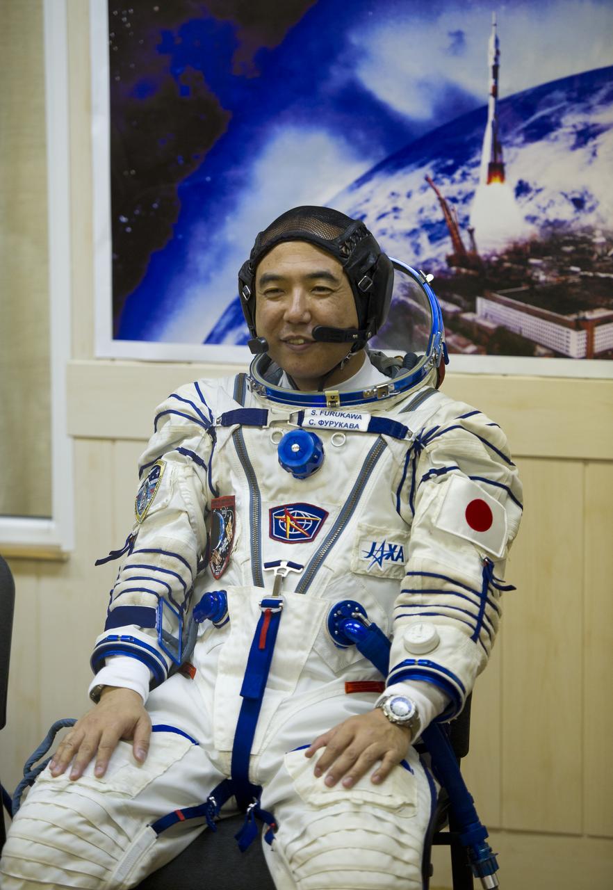 JAXA (Japanese Aerospace Exploration Agency) Flight Engineer Satoshi Furukawa awaits to have his Russian Sokol suit pressure checked in preparation for his launch onboard the Soyuz TMA-02M on Tuesday, June 7, 2011 at the Baikonur Cosmodrome in Kazakhstan.  The Soyuz spacecraft will carry Expedition 28 Soyuz Commander Sergei Volkov, NASA Flight Engineer Mike Fossum, and Furukawa to the International Space Station.  Photo Credit:  (NASA/Carla Cioffi)