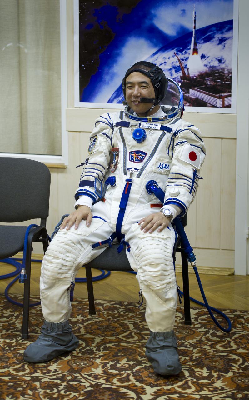 JAXA (Japanese Aerospace Exploration Agency) Flight Engineer Satoshi Furukawa awaits to have his Russian Sokol suit pressure checked in preparation for his launch onboard the Soyuz TMA-02M on Tuesday, June 7, 2011 at the Baikonur Cosmodrome in Kazakhstan.  The Soyuz spacecraft will carry Expedition 28 Soyuz Commander Sergei Volkov, NASA Flight Engineer Mike Fossum, and Furukawa to the International Space Station.  Photo Credit:  (NASA/Carla Cioffi)