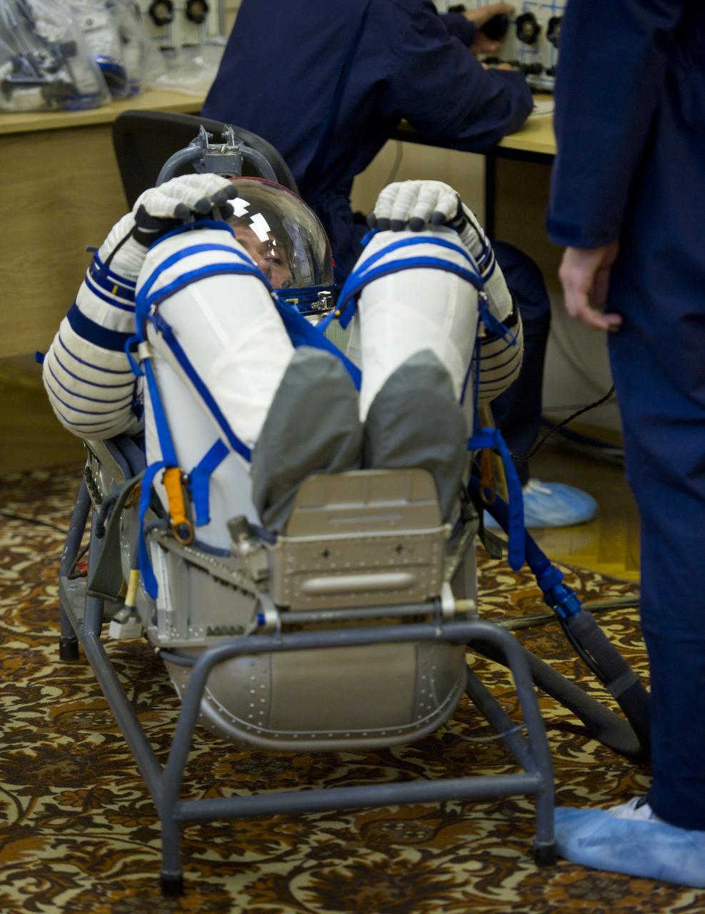 Expedition 28 Soyuz Commander Sergei Volkov has his Russian Sokol suit pressure checked in preparation for his launch to the International Space Station, Tuesday, June 7, 2011 at the Baikonur Cosmodrome in Kazakhstan.  The Soyuz spacecraft will launch the following morning on June 8 carrying Volkov, NASA Flight Engineer Mike Fossum and JAXA (Japanese Aerospace Exploration Agency) Flight Engineer Satoshi Furukawa.  Photo Credit:  (NASA/Carla Cioffi)