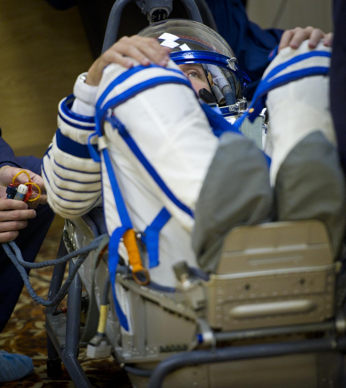 Expedition 28 Soyuz Commander Sergei Volkov has his Russian Sokol suit pressure checked in preparation for his launch to the International Space Station, Tuesday, June 7, 2011 at the Baikonur Cosmodrome in Kazakhstan.  The Soyuz spacecraft will launch the following morning on June 8 carrying Volkov, NASA Flight Engineer Mike Fossum and JAXA (Japanese Aerospace Exploration Agency) Flight Engineer Satoshi Furukawa.  Photo Credit:  (NASA/Carla Cioffi)