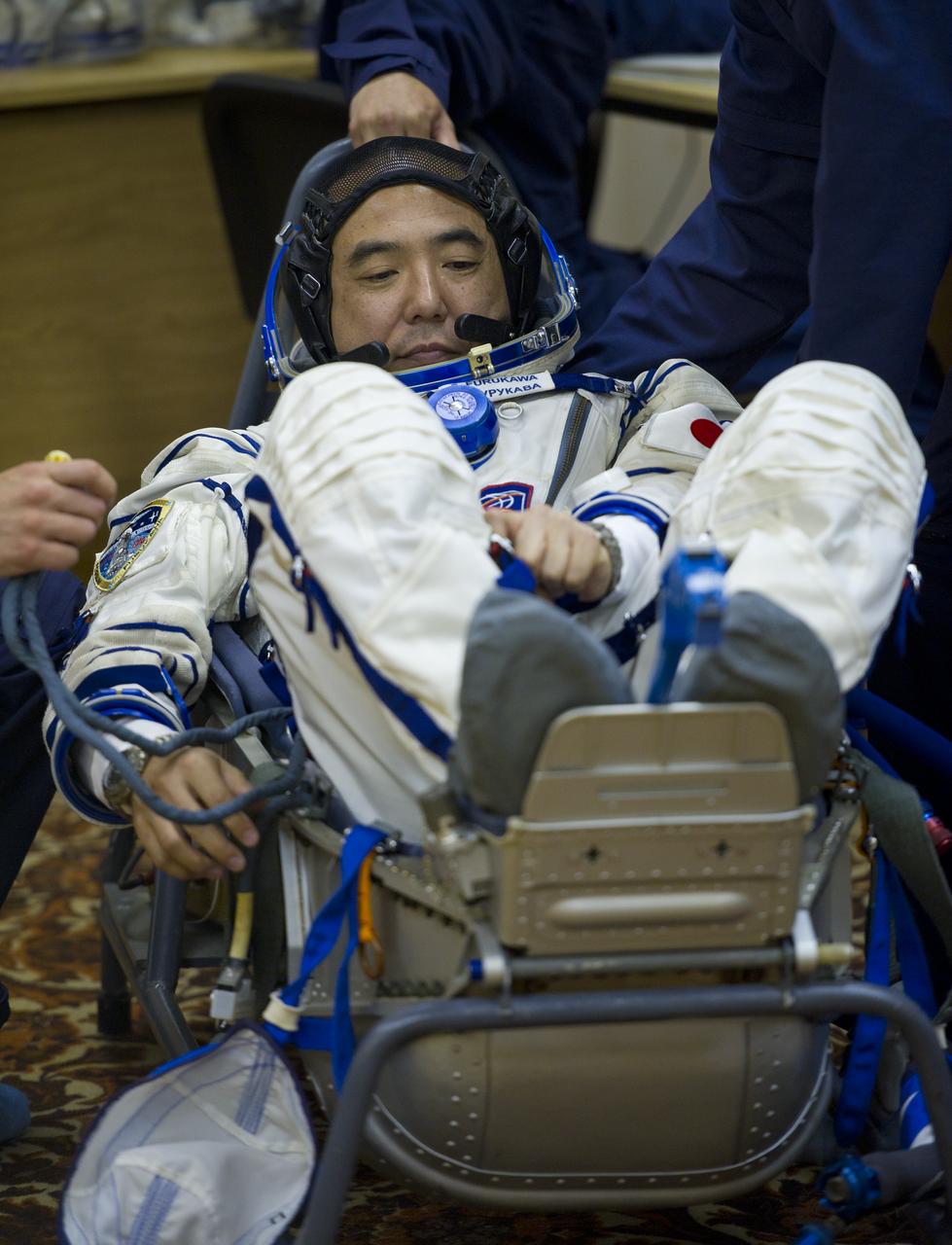 JAXA (Japanese Aerospace Exploration Agency) astronaut and Expedition 28 Flight Engineer Satoshi Furukawa has his Russian Sokol suit pressure checked in preparation for his launch to the International Space Station, Tuesday, June 7, 2011 at the Baikonur Cosmodrome in Kazakhstan.  The Soyuz spacecraft will launch the following morning on June 8 carrying Expedition 28 Soyuz Commander Sergei Volkov, NASA Flight Engineer Mike Fossum and Furukawa.  Photo Credit:  (NASA/Carla Cioffi)