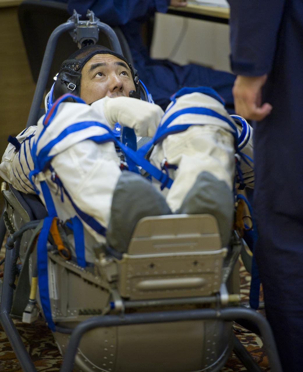 JAXA (Japanese Aerospace Exploration Agency) astronaut and Expedition 28 Flight Engineer Satoshi Furukawa has his Russian Sokol suit pressure checked in preparation for his launch to the International Space Station, Tuesday, June 7, 2011 at the Baikonur Cosmodrome in Kazakhstan.  The Soyuz spacecraft will launch the following morning on June 8 carrying Expedition 28 Soyuz Commander Sergei Volkov, NASA Flight Engineer Mike Fossum and Furukawa.  Photo Credit:  (NASA/Carla Cioffi)