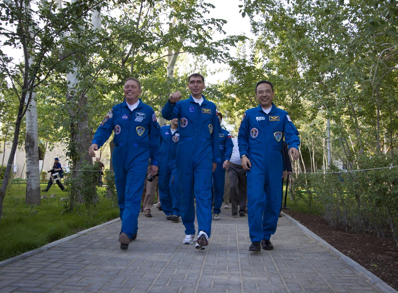 The crew of Expedition 28 depart the Cosmonaut Hotel on the evening before their Soyuz launch to the International Space Station Tuesday, June 7, 2011 in Baikonur, Kazakhstan.  Pictured from left is Expedition 28 Expedition 28 NASA Flight Engineer Mike Fossum, Soyuz Commander Sergei Volkov and JAXA Flight Engineer Satoshi Furukawa.  Photo Credit: (NASA/Carla Cioffi)