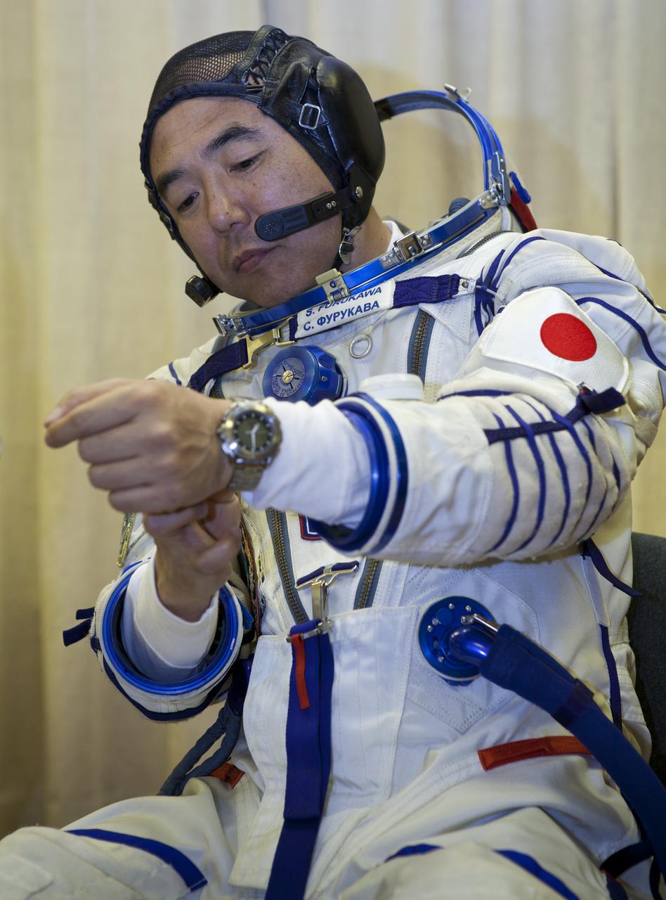 Expedition 28 JAXA (Japan Aerospace Exploration Agency) astronaut and Flight Engineer Satoshi Furukawa has his Russian Sokol suit prepared for launch at the Baikonur Cosmodrome in Baikonur, Kazakhstan, Tuesday, June 7, 2011.  Furukawa and fellow Expedition 28 crew members Soyuz Commander Sergei Volkov and NASA Flight Engineer Mike Fossum launched in their Soyuz TMA-02M rocket from the Baikonur Cosmodrome in Kazakhstan the following morning on June 8th. Photo Credit: (NASA/Roscosmos/Andrey Shelepin)