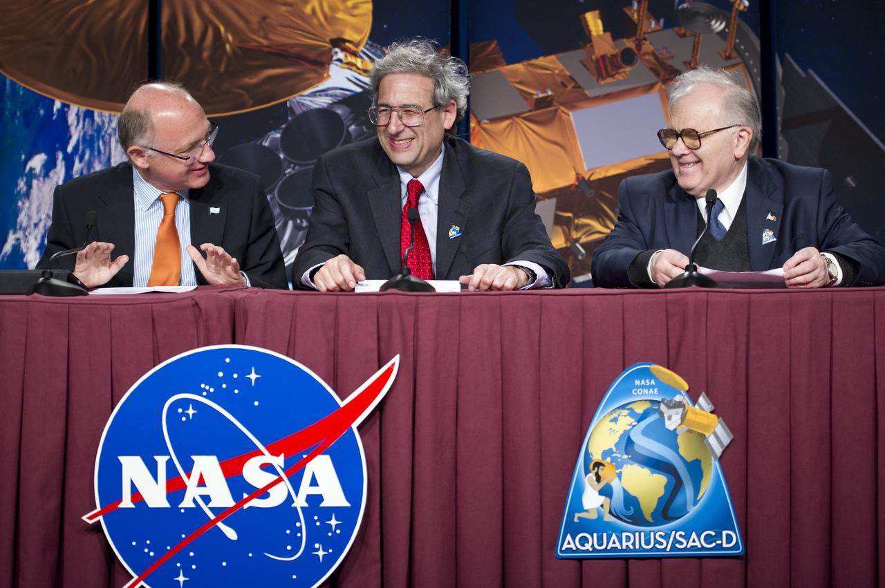 Hector Timerman, Foreign Minister of Argentina, Buenos Aires, left, Michael Freilich, NASA Earth Science Division Director, NASA Headquarters, Washington, center, and Conrado Varotto, CONAE Executive and Technical Director, Buenos Aires, laugh at the start of the Aquarius/SAC-D post-launch press conference on Friday, June 10, 2011 at the NASA Resident Office, Vandenberg Air Force Base, Calif. The joint U.S./Argentinian Aquarius/Satélite de Aplicaciones Científicas (SAC)-D mission, launched earlier on Friday June 10, will map the salinity at the ocean surface, information critical to improving our understanding of two major components of Earth's climate system: the water cycle and ocean circulation. Photo Credit: (NASA/Bill Ingalls)