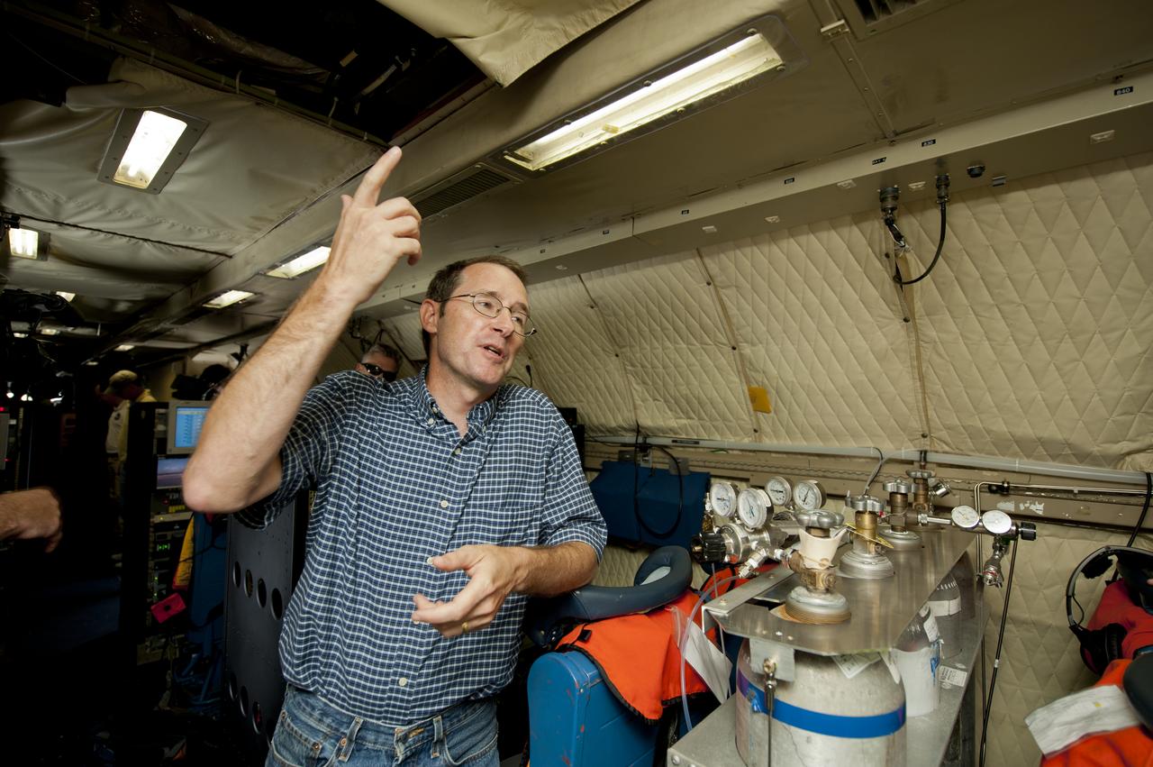 James Crawford, principal investigator and scientist based at NASA’s Langley Research Center in Hampton, Va., talks about the DISCOVER-AQ project on board the P-3B NASA research aircraft at Baltimore/Washington International Thurgood Marshall Airport, Tuesday, June 28, 2011, in Baltimore, Md. The aircraft is part of a month-long field campaign designed to improve satellite measurements of air pollution. The name of the experiment -- Deriving Information on Surface conditions from Column and Vertically Resolved Observations Relevant to Air Quality (DISCOVER -- AQ) -- is a mouthful, but its purpose is simple. Come July, the aircraft will be flying spirals over six ground stations in Maryland.  Photo Credit: (NASA/Paul E. Alers)