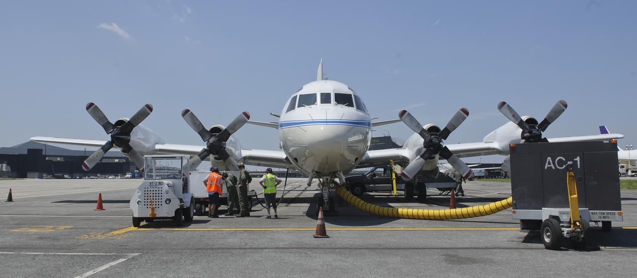 A 117-foot P-3B NASA research aircraft is seen on the tarmac at Baltimore/Washington International Thurgood Marshall Airport, Tuesday, June 28, 2011, in Baltimore, Md. The aircraft is part of a month-long field campaign designed to improve satellite measurements of air pollution. The name of the experiment -- Deriving Information on Surface conditions from Column and Vertically Resolved Observations Relevant to Air Quality (DISCOVER -- AQ) -- is a mouthful, but its purpose is simple. Come July, the aircraft will be flying spirals over six ground stations in Maryland.  Photo Credit: (NASA/Paul E. Alers)