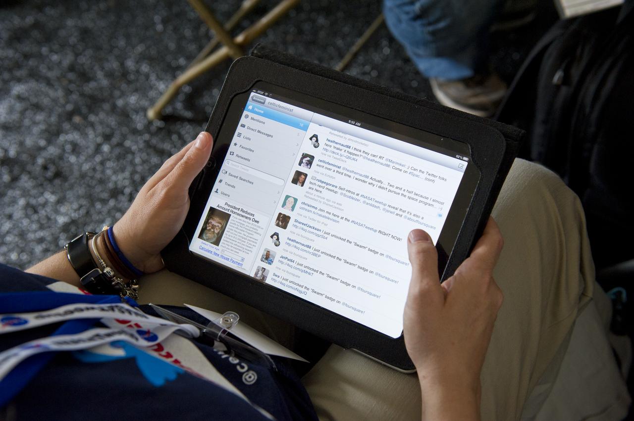 Cassie Barnes, Twitter handle @celticfeminist, tweets during the STS-135 Tweetup, Thursday, July 7, 2011, at Kennedy Space Center in Cape Canaveral, Fla. About 150 NASA Twitter followers attended the event.  The STS-135 mission will be NASA's last space shuttle launch.  Photo Credit: (NASA/Paul E. Alers)