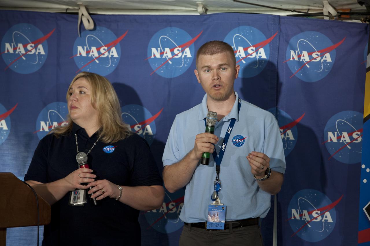 Tracy Thumm, left, and Justin Kugler both from the International Space Station Program Science Office at Johnson Space Center speak at the STS-135 Tweetup, Thursday, July 7, 2011, at Kennedy Space Center in Cape Canaveral, Fla.  About 150 NASA Twitter followers attended the event.  The STS-135 mission will be NASA's last space shuttle launch.  Photo Credit: (NASA/Paul E. Alers)