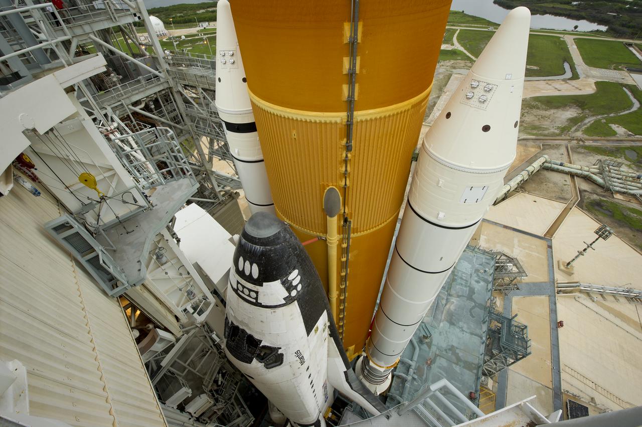 The space shuttle Atlantis is revealed as the rotating service structure (RSS) is rolled back at launch pad 39a on Thursday, July 7, 2011 at the NASA Kennedy Space Center in Cape Canaveral, Fla.  Atlantis is set to liftoff Friday, July 8, on the final flight of the shuttle program, STS-135, a 12-day mission to the International Space Station.  Photo Credit: (NASA/Bill Ingalls)