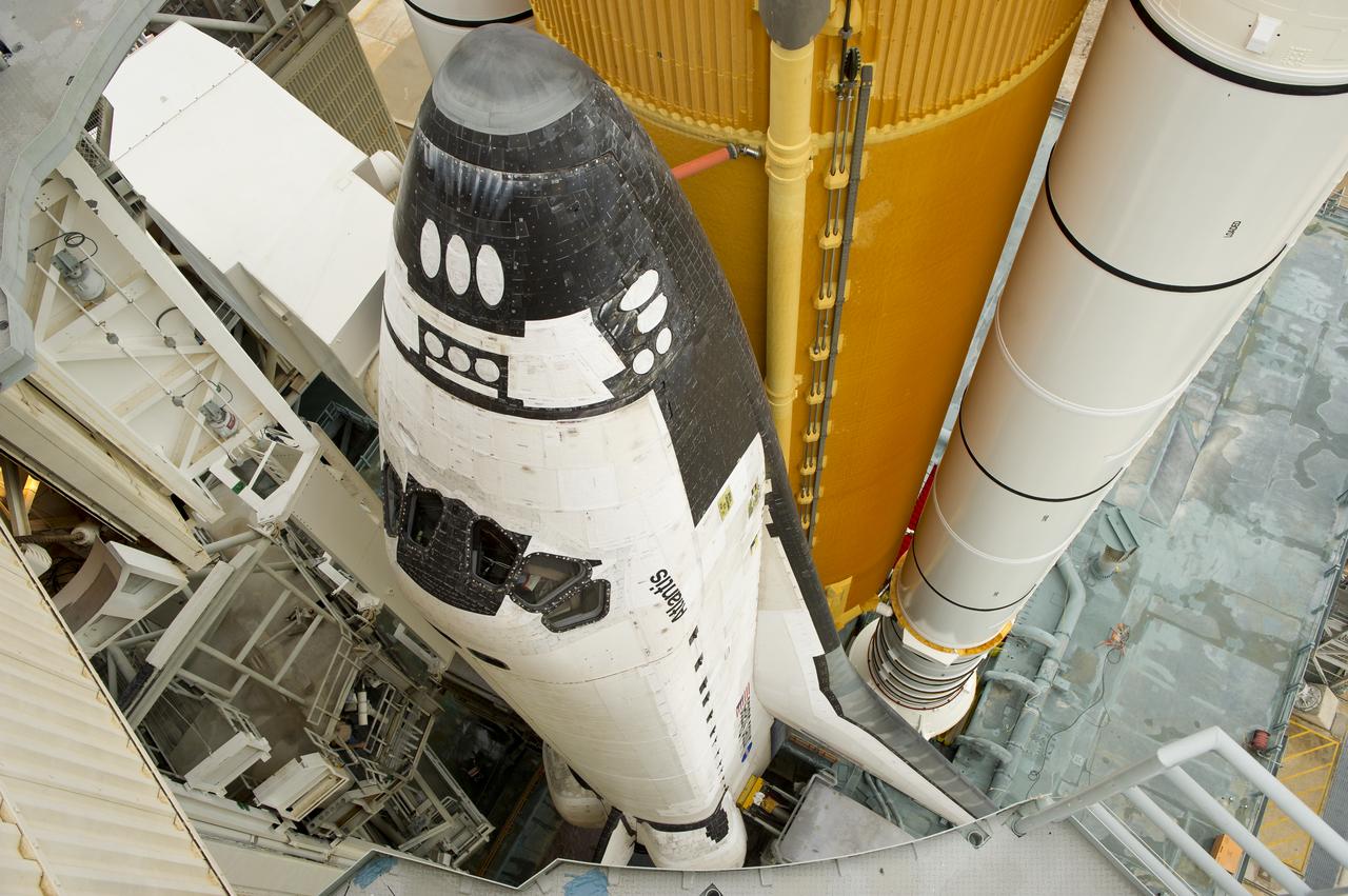 The space shuttle Atlantis is revealed as the rotating service structure (RSS) is rolled back at launch pad 39a on Thursday, July 7, 2011 at the NASA Kennedy Space Center in Cape Canaveral, Fla.  Atlantis is set to liftoff Friday, July 8, on the final flight of the shuttle program, STS-135, a 12-day mission to the International Space Station.  Photo Credit: (NASA/Bill Ingalls)