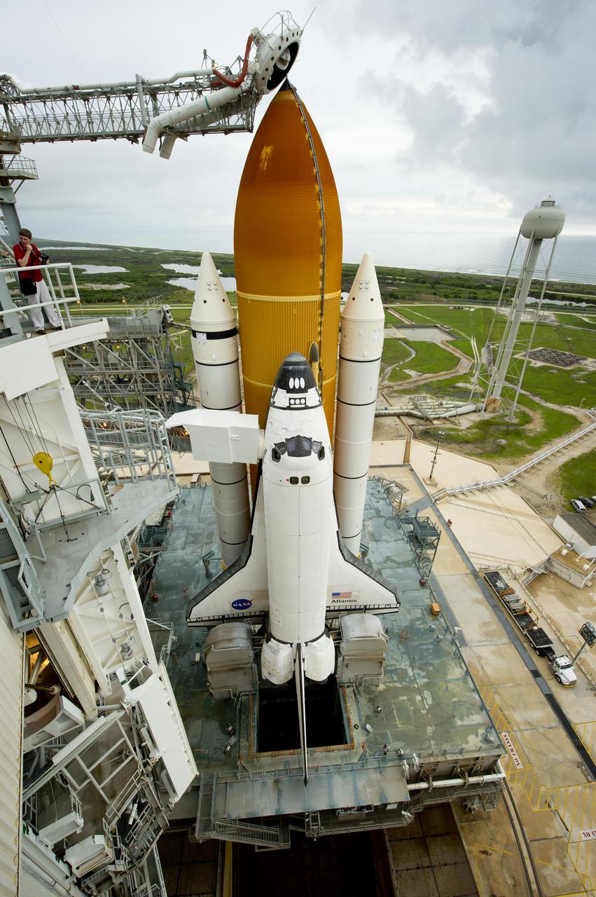 The space shuttle Atlantis is revealed as the rotating service structure (RSS) is rolled back at launch pad 39a on Thursday, July 7, 2011 at the NASA Kennedy Space Center in Cape Canaveral, Fla.  Atlantis is set to liftoff Friday, July 8, on the final flight of the shuttle program, STS-135, a 12-day mission to the International Space Station.  Photo Credit: (NASA/Bill Ingalls)