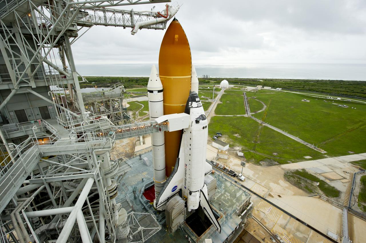 The space shuttle Atlantis is revealed as the rotating service structure (RSS) is rolled back at launch pad 39a on Thursday, July 7, 2011 at the NASA Kennedy Space Center in Cape Canaveral, Fla.  Atlantis is set to liftoff Friday, July 8, on the final flight of the shuttle program, STS-135, a 12-day mission to the International Space Station.  Photo Credit: (NASA/Bill Ingalls)
