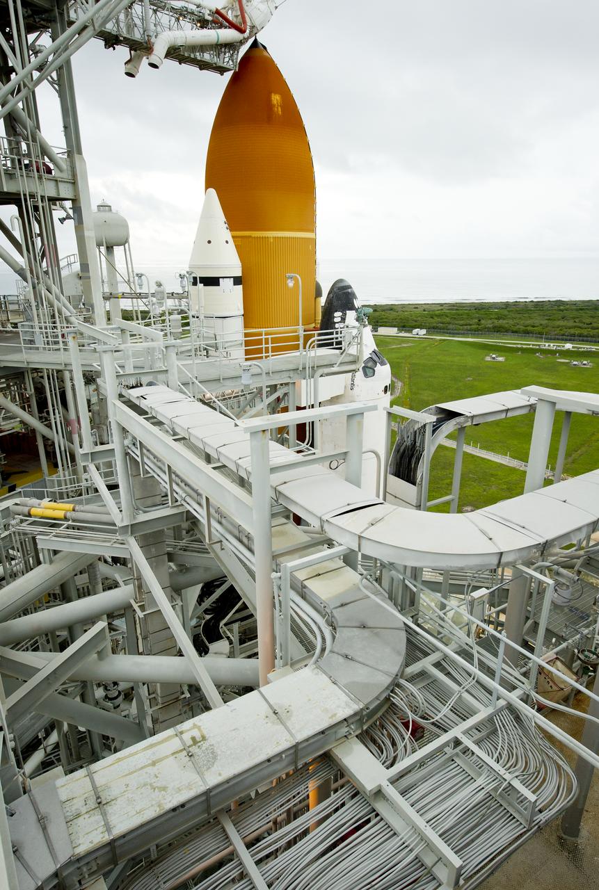 The space shuttle Atlantis is revealed as the rotating service structure (RSS) is rolled back at launch pad 39a on Thursday, July 7, 2011 at the NASA Kennedy Space Center in Cape Canaveral, Fla.  Atlantis is set to liftoff Friday, July 8, on the final flight of the shuttle program, STS-135, a 12-day mission to the International Space Station.  Photo Credit: (NASA/Bill Ingalls)