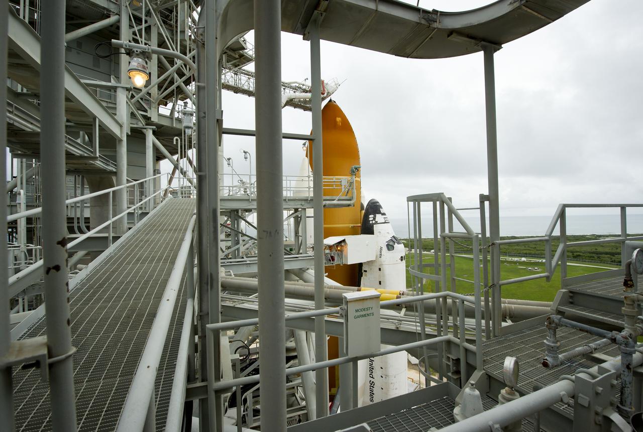 The space shuttle Atlantis is revealed as the rotating service structure (RSS) is rolled back at launch pad 39a on Thursday, July 7, 2011 at the NASA Kennedy Space Center in Cape Canaveral, Fla.  Atlantis is set to liftoff Friday, July 8, on the final flight of the shuttle program, STS-135, a 12-day mission to the International Space Station.  Photo Credit: (NASA/Bill Ingalls)