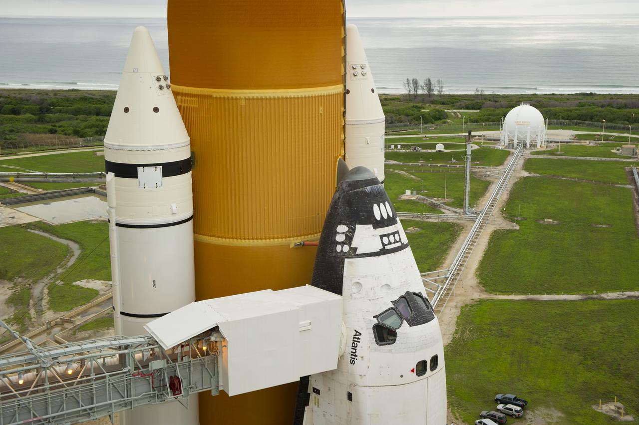 The space shuttle Atlantis is revealed as the rotating service structure (RSS) is rolled back at launch pad 39a on Thursday, July 7, 2011 at the NASA Kennedy Space Center in Cape Canaveral, Fla.  Atlantis is set to liftoff Friday, July 8, on the final flight of the shuttle program, STS-135, a 12-day mission to the International Space Station.  Photo Credit: (NASA/Bill Ingalls)