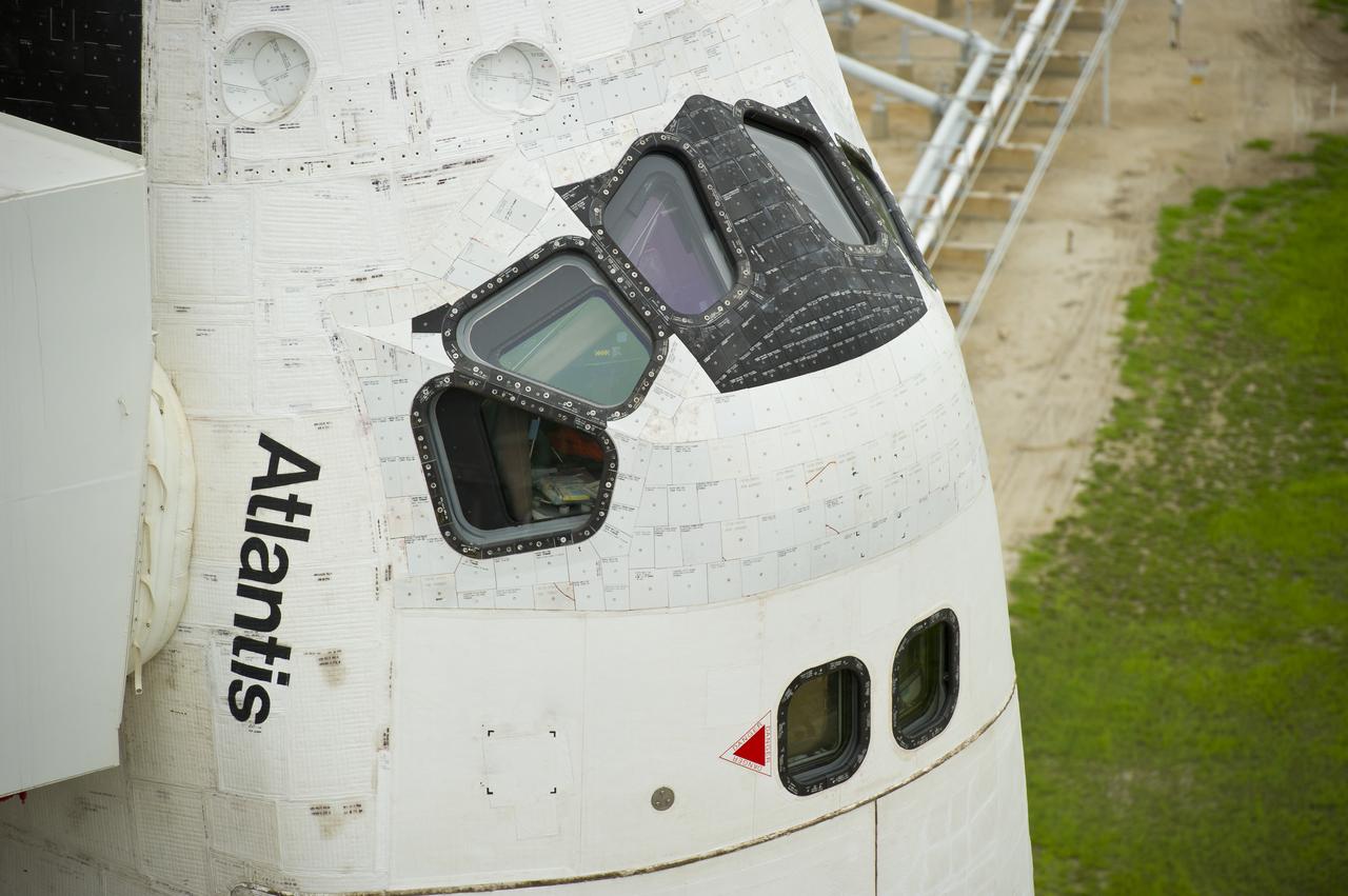 The space shuttle Atlantis is revealed as the rotating service structure (RSS) is rolled back at launch pad 39a on Thursday, July 7, 2011 at the NASA Kennedy Space Center in Cape Canaveral, Fla.  Atlantis is set to liftoff Friday, July 8, on the final flight of the shuttle program, STS-135, a 12-day mission to the International Space Station.  Photo Credit: (NASA/Bill Ingalls)
