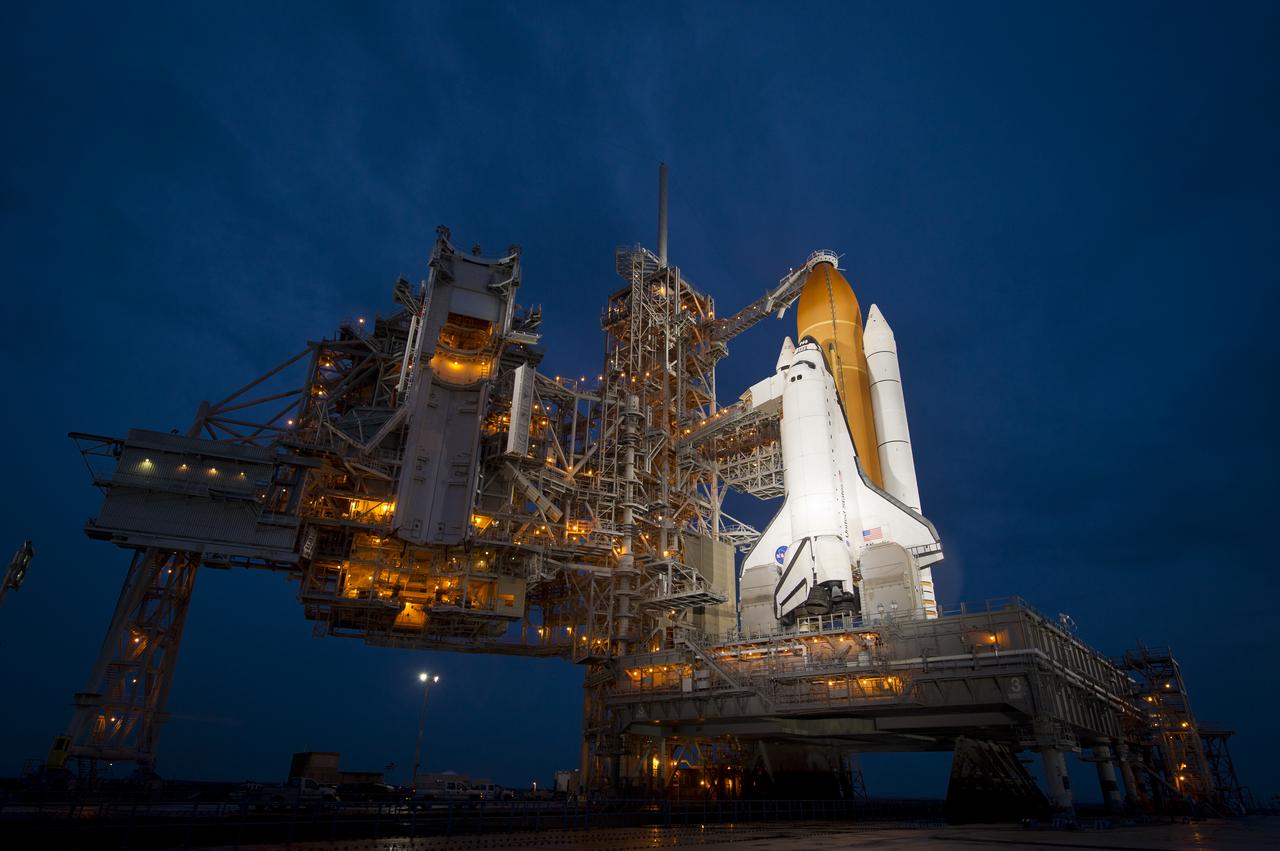 The space shuttle Atlantis is seen shortly after the rotating service structure (RSS) was rolled back at launch pad 39a, Thursday, July 7, 2011 at the NASA Kennedy Space Center in Cape Canaveral, Fla.  Atlantis is set to liftoff Friday, July 8, on the final flight of the shuttle program, STS-135, a 12-day mission to the International Space Station.  Photo Credit: (NASA/Bill Ingalls)