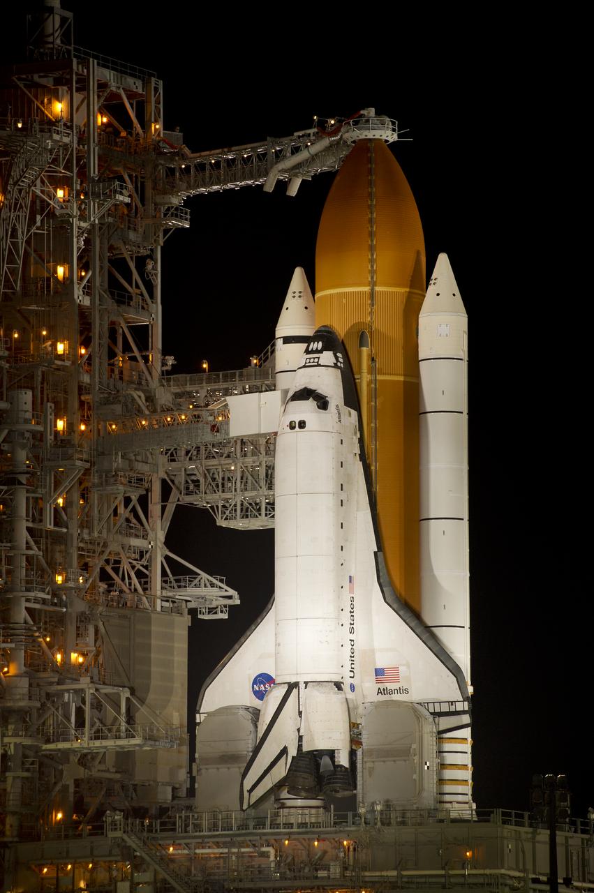 The space shuttle Atlantis is seen shortly after the rotating service structure (RSS) was rolled back at launch pad 39a, Thursday, July 7, 2011 at the NASA Kennedy Space Center in Cape Canaveral, Fla.  Atlantis is set to liftoff Friday, July 8, on the final flight of the shuttle program, STS-135, a 12-day mission to the International Space Station.  Photo Credit: (NASA/Bill Ingalls)
