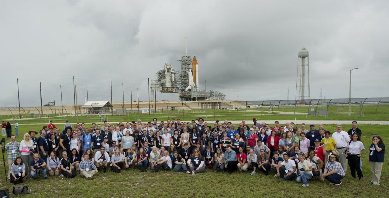 STS-135 Tweetup participants are seen outside launch pad 39a and space shuttle Atlantis following the Rotating Service Structure rollback, Thursday, July 7, 2011, at Kennedy Space Center in Cape Canaveral, Fla.About 150 NASA Twitter followers attended the event.  The STS-135 mission will be NASA's last space shuttle launch.  Photo Credit:  (NASA/Paul E. Alers) 