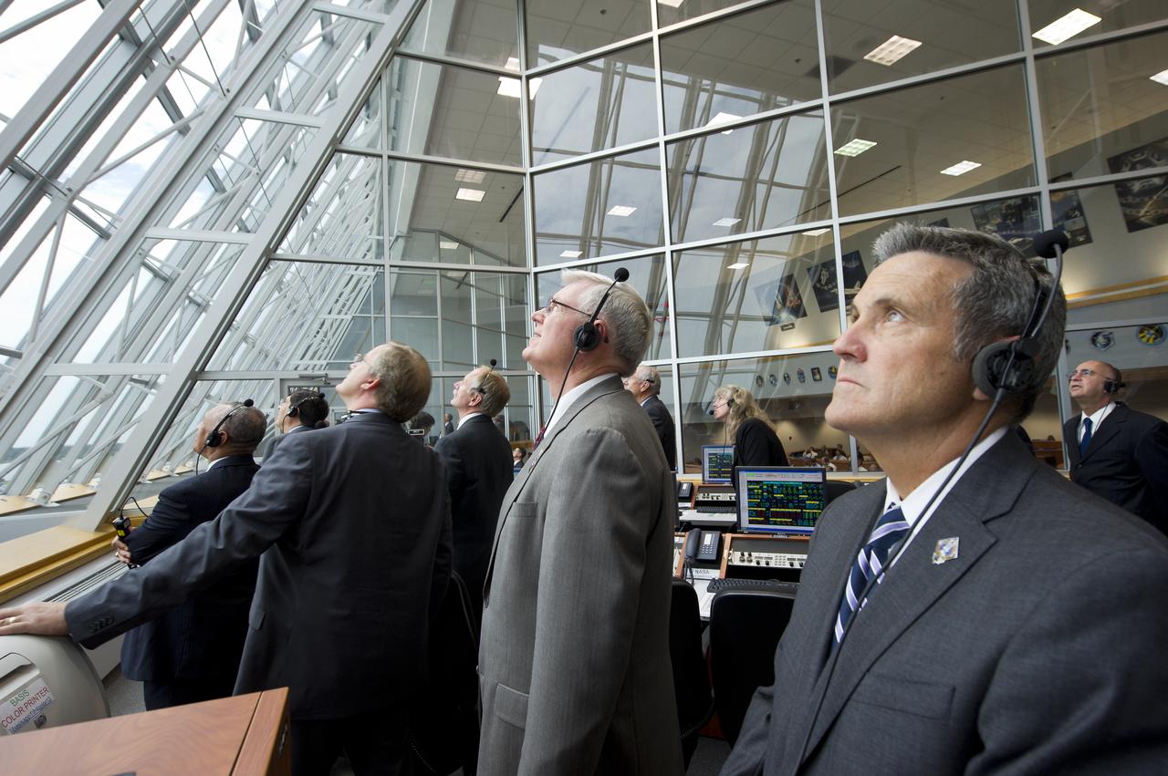 NASA Kennedy Space Center Director Bob Cabana, right, and other management look on from Firing Room Four of the Launch Control Center (LCC) as space shuttle Atlantis launches from pad 39A on Friday, July 8, 2011, in Cape Canaveral, Fla. The launch of Atlantis, STS-135, is the final flight of the shuttle program, a 12-day mission to the International Space Station.  Photo Credit: (NASA/Bill Ingalls)