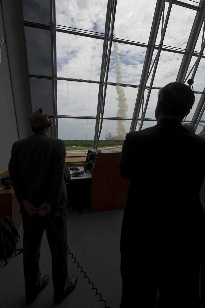 NASA management look on from Firing Room Four of the Launch Control Center (LCC) as space shuttle Atlantis launches from pad 39A on Friday, July 8, 2011, in Cape Canaveral, Fla. The launch of Atlantis, STS-135, is the final flight of the shuttle program, a 12-day mission to the International Space Station.  Photo Credit: (NASA/Bill Ingalls)
