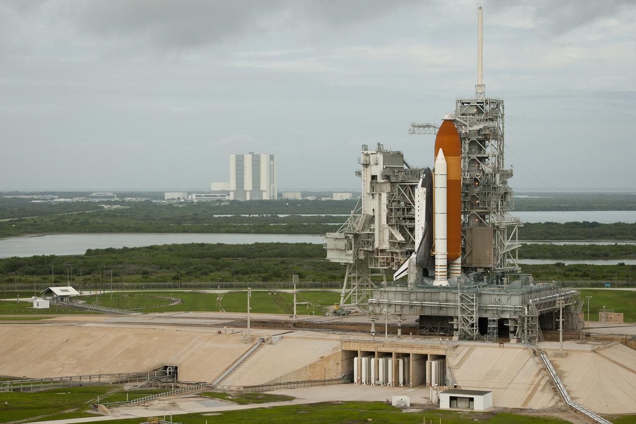 Space shuttle Atlantis is seen on launch pad 39a moments before the STS-135 crew arrives for their launch, Friday, July 8, 2011, at the NASA Kennedy Space Center in Cape Canaveral, Fla. The launch of Atlantis, STS-135, is the final flight of the shuttle program, a 12-day mission to the International Space Station.  Photo Credit: (NASA/Bill Ingalls)