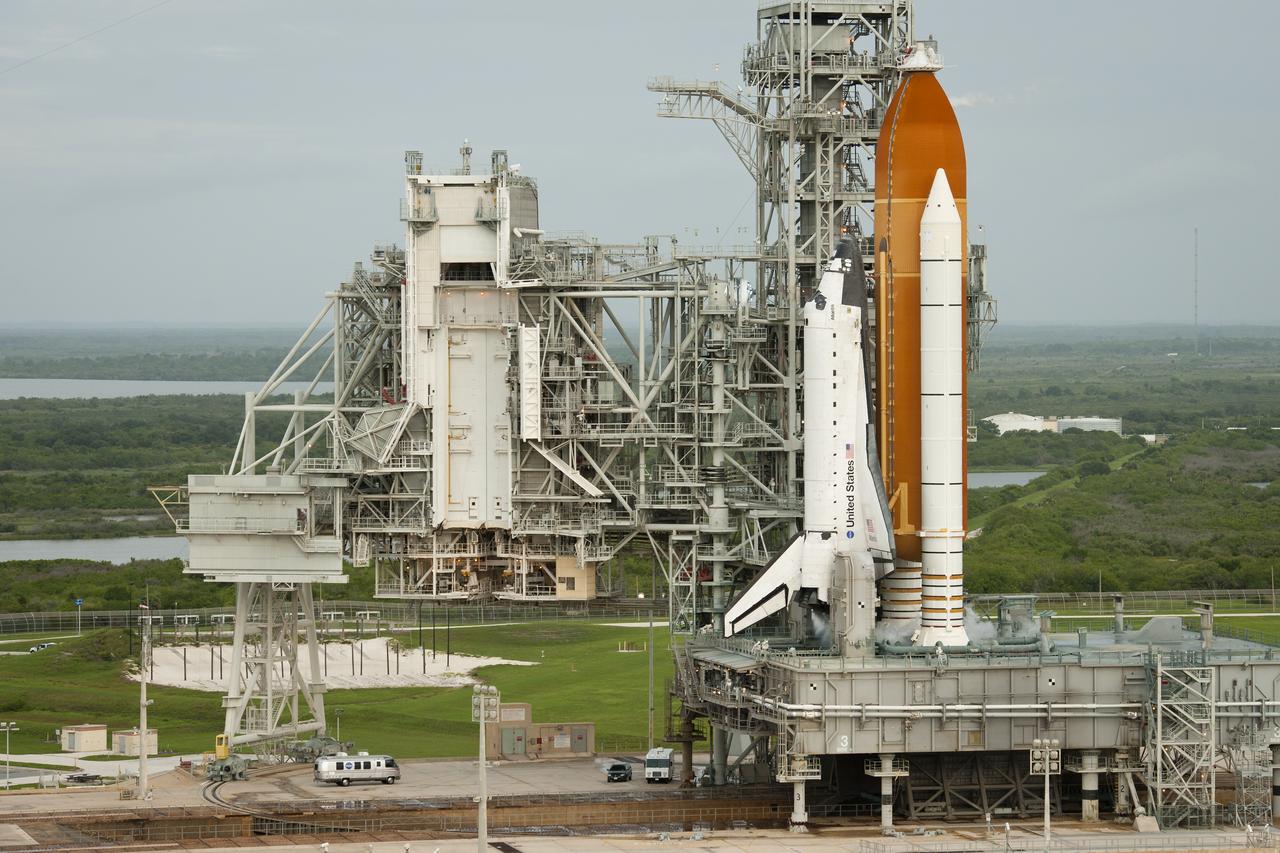 The Astrovan carrying the STS-135 crew; Chris Ferguson, commander, Doug Hurley, pilot, and mission specialists Rex Walheim and Sandy Mangus, arrives at launch pad 39A and space shuttle Atlantis, Friday, July 8, 2011, at Kennedy Space Center in Cape Canaveral, Fla. The launch of Atlantis, STS-135, is the final flight of the shuttle program, a 12-day mission to the International Space Station.  Photo Credit: (NASA/Bill Ingalls)