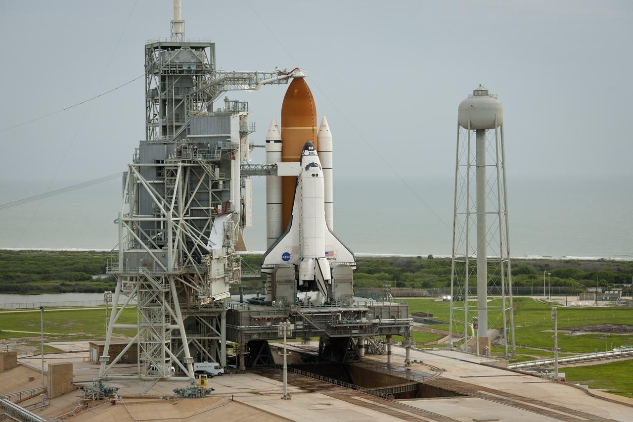 Space shuttle Atlantis is seen on launch pad 39a moments after the STS-135 crew arrived for their launch, Friday, July 8, 2011, at the NASA Kennedy Space Center in Cape Canaveral, Fla. The launch of Atlantis, STS-135, is the final flight of the shuttle program, a 12-day mission to the International Space Station.  Photo Credit: (NASA/Bill Ingalls)