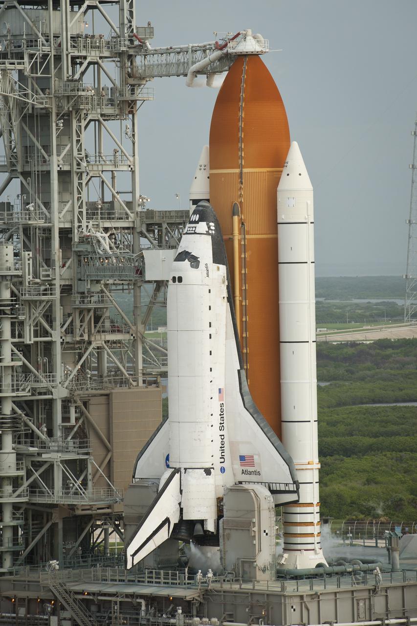 Space shuttle Atlantis is seen on launch pad 39a moments after the STS-135 crew arrived for their launch, Friday, July 8, 2011, at the NASA Kennedy Space Center in Cape Canaveral, Fla. The launch of Atlantis, STS-135, is the final flight of the shuttle program, a 12-day mission to the International Space Station.  Photo Credit: (NASA/Bill Ingalls)