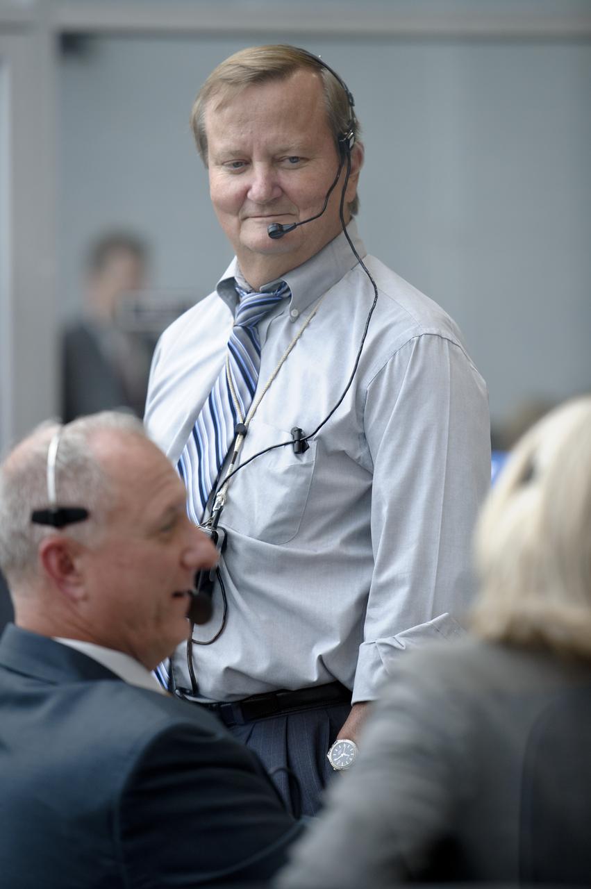 NASA Shuttle Launch Director Michael Leinbach talks with other members of teh launch team as they monitor the launch countdown from Firing Room Four of the Launch Control Center (LCC) at NASA's Kennedy Space Center on Friday, July 8, 2011, in Cape Canaveral, Fla. The launch of Atlantis, STS-135, is the final flight of the shuttle program, a 12-day mission to the International Space Station.  Photo Credit: (NASA/Bill Ingalls)