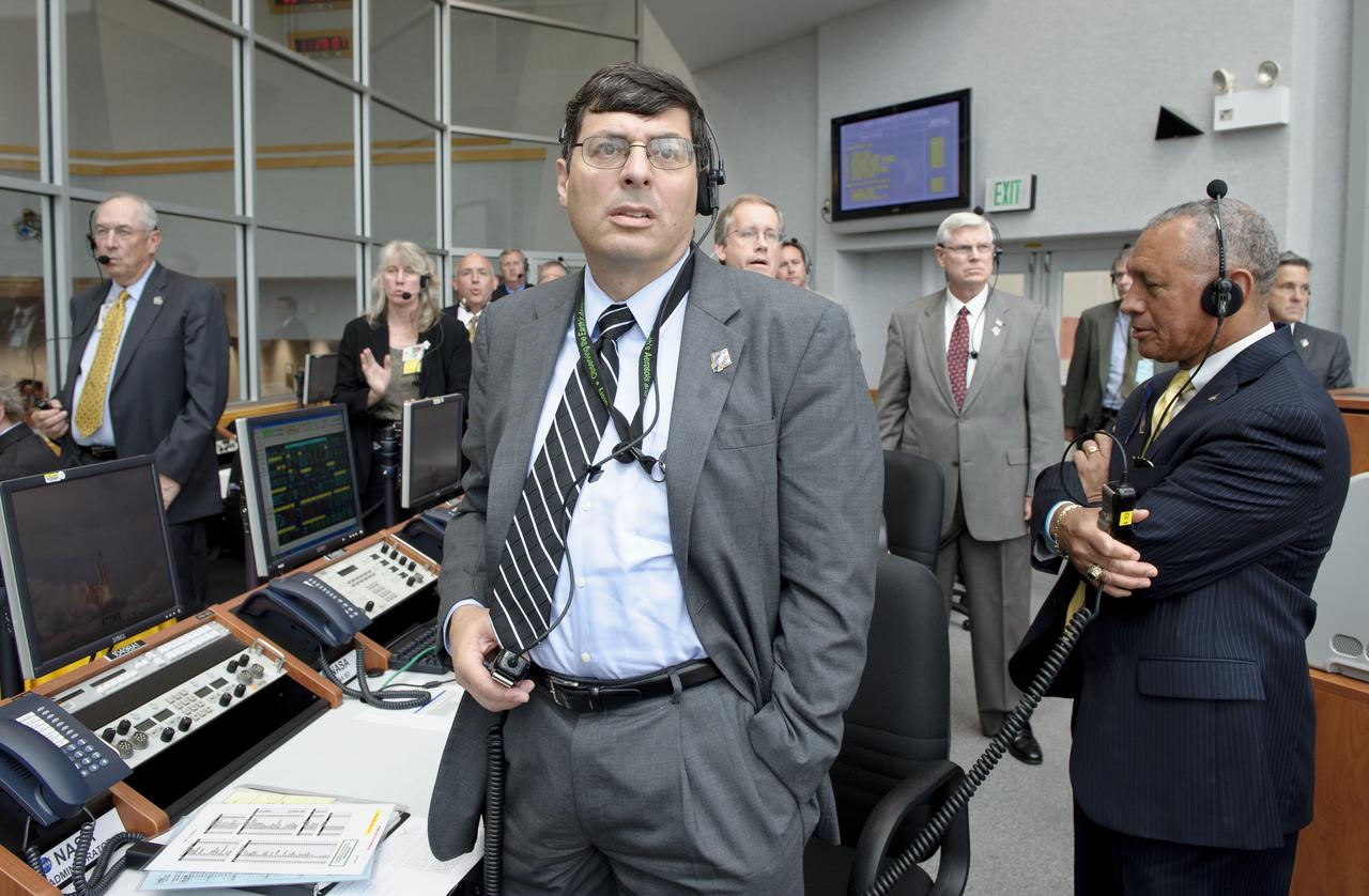 NASA Administrator Charles Bolden, right, Associate Administrator Christopher Scolese, left, and other management look on from Firing Room Four of the Launch Control Center (LCC) as space shuttle Atlantis launches from pad 39A on Friday, July 8, 2011, in Cape Canaveral, Fla. The launch of Atlantis, STS-135, is the final flight of the shuttle program, a 12-day mission to the International Space Station.  Photo Credit: (NASA/Bill Ingalls)