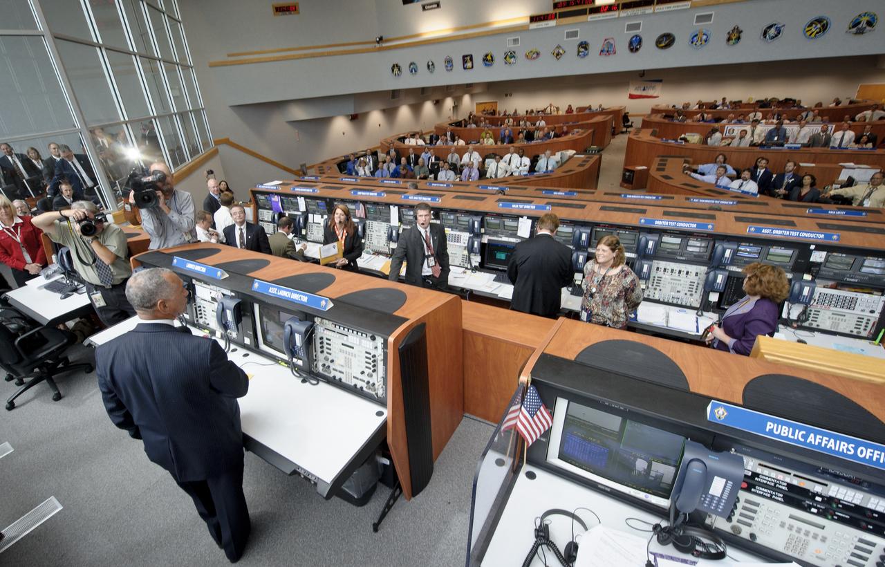 NASA Administrator Charles Bolden congratulates the launch team in the NASA Kennedy Space Center Firing Room Four of the Launch Control Center (LCC) shortly after the space shuttle Atlantis, STS-135, launched on Friday, July 8, 2011, in Cape Canaveral, Fla. The launch of Atlantis is the final flight of the shuttle program, a 12-day mission to the International Space Station.  Photo Credit: (NASA/Bill Ingalls)