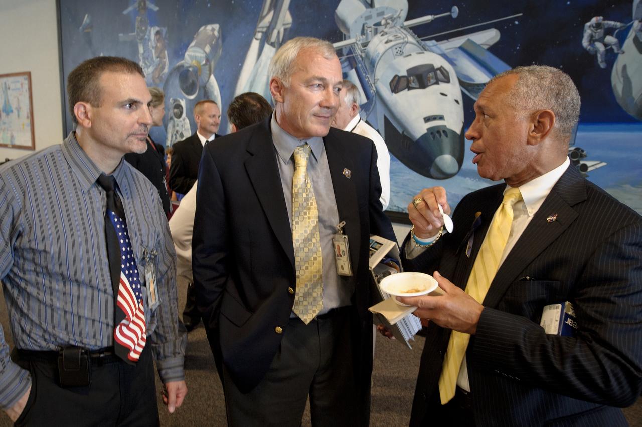 NASA Administrator Charles Bolden, right, talks with NASA Space Shuttle Flight Safety Manager Peter Panetta, left, and NASA Director, Safety and Mission Assurance, Johnson Space Center, and former Astronaut Terrence Wilcutt during the traditional post launch beans and cornbread reception at the NASA Kennedy Space Center, Launch Control Center (LCC) shortly after the space shuttle Atlantis, STS-135, launched on Friday, July 8, 2011, in Cape Canaveral, Fla. The launch of Atlantis is the final flight of the shuttle program, a 12-day mission to the International Space Station.  Photo Credit: (NASA/Bill Ingalls)