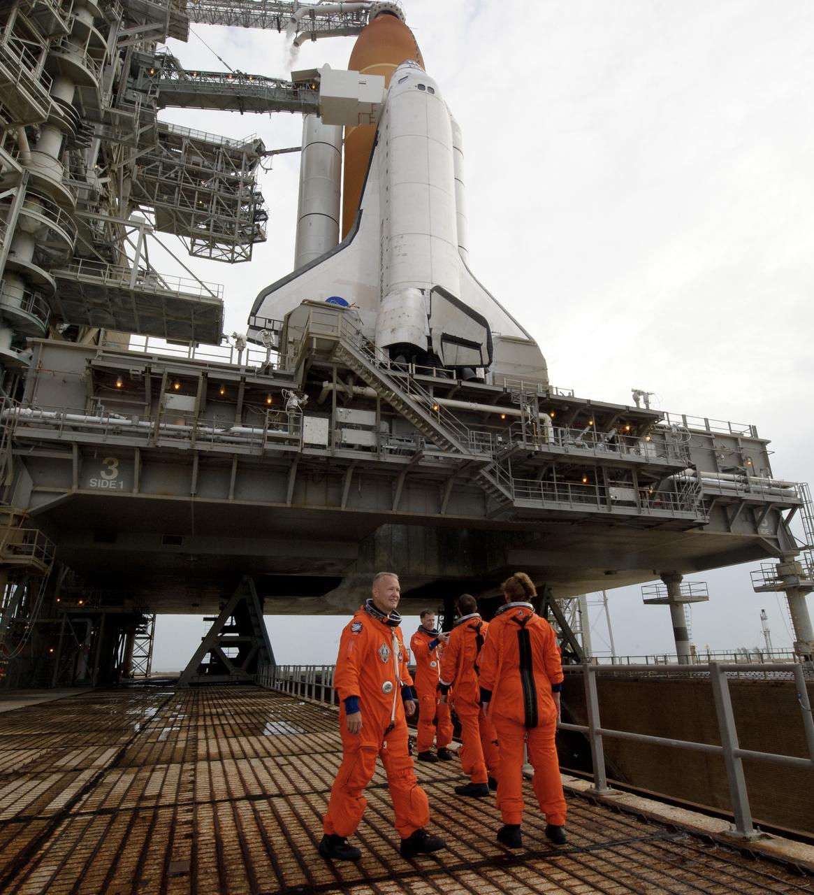 The STS-135 crew; Chris Ferguson, commander; Doug Hurley, pilot;, left, Rex Walheim and Sandy Magnus, both mission specialists are seen before boarding space shuttle Atlantis at launch pad 39A prior to launch, Friday, July 8, 2011 at the NASA Kennedy Space Center in Cape Canaveral, Fla. The launch of Atlantis, STS-135, is the final flight of the shuttle program, a 12-day mission to the International Space Station. Photo Credit: (NASA/Jerry Ross)