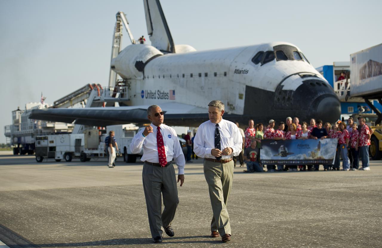 NASA Administrator Charles Bolden, left, and NASA Kennedy Space center Director Robert Cabana walk along the Shuttle Landing Facility (SLF) runway at NASA Kennedy Space Center shortly after the space shuttle Atlantis (STS-135) landed, completing its 13-day mission to the International Space Station (ISS) and the final flight of the Space Shuttle Program, early Thursday morning, July 21, 2011, in Cape Canaveral, Fla. Overall, Atlantis spent 307 days in space and traveled nearly 126 million miles during its 33 flights. Atlantis, the fourth orbiter built, launched on its first mission on Oct. 3, 1985. Photo Credit: (NASA/Bill Ingalls)