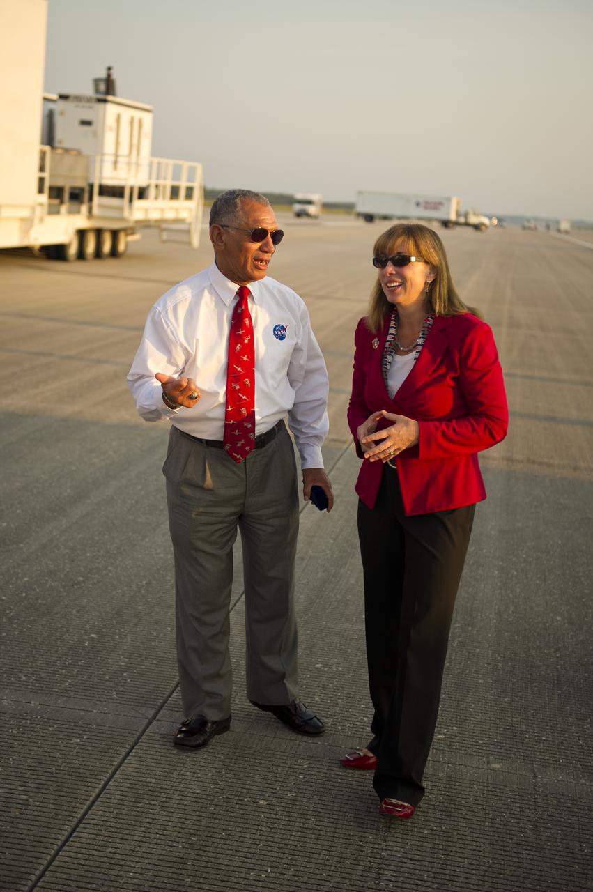 NASA Administrator Charles Bolden and Deputy Administrator Lori Garver talk at the Kennedy Space Center Shuttle Landing Facility (SLF) shortly after the space shuttle Atlantis (STS-135) landed early Thursday morning, July 21, 2011, in Cape Canaveral, Fla. Overall, Atlantis spent 307 days in space and traveled nearly 126 million miles during its 33 flights. Atlantis, the fourth orbiter built, launched on its first mission on Oct. 3, 1985. Photo Credit: (NASA/Bill Ingalls)