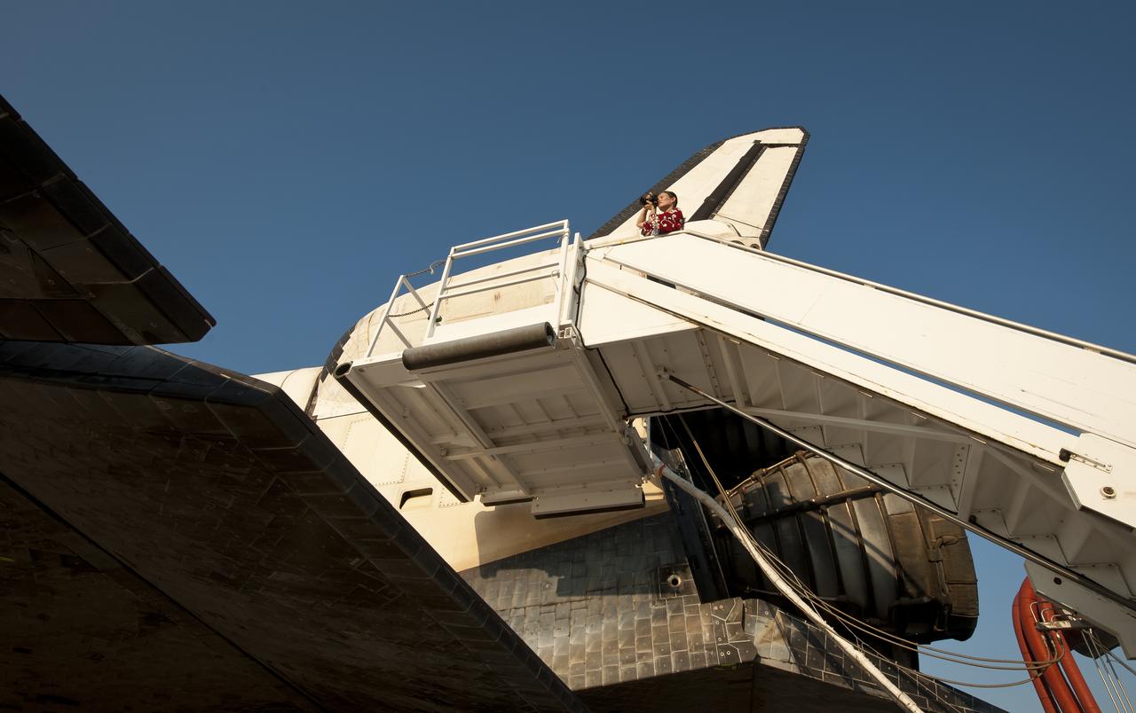 NASA and contractor personnel work on the space shuttle Atlantis at the Kennedy Space Center Shuttle Landing Facility (SLF) shortly after Atlantis (STS-135) landed early Thursday morning, July 21, 2011, in Cape Canaveral, Fla. Overall, Atlantis spent 307 days in space and traveled nearly 126 million miles during its 33 flights. Atlantis, the fourth orbiter built, launched on its first mission on Oct. 3, 1985. Photo Credit: (NASA/Bill Ingalls)