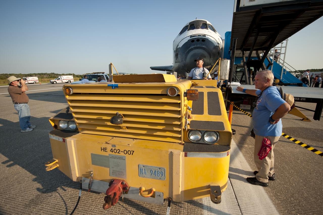 NASA and contractor personnel work on the space shuttle Atlantis at the Kennedy Space Center Shuttle Landing Facility (SLF) shortly after Atlantis (STS-135) landed early Thursday morning, July 21, 2011, in Cape Canaveral, Fla. Overall, Atlantis spent 307 days in space and traveled nearly 126 million miles during its 33 flights. Atlantis, the fourth orbiter built, launched on its first mission on Oct. 3, 1985. Photo Credit: (NASA/Bill Ingalls)