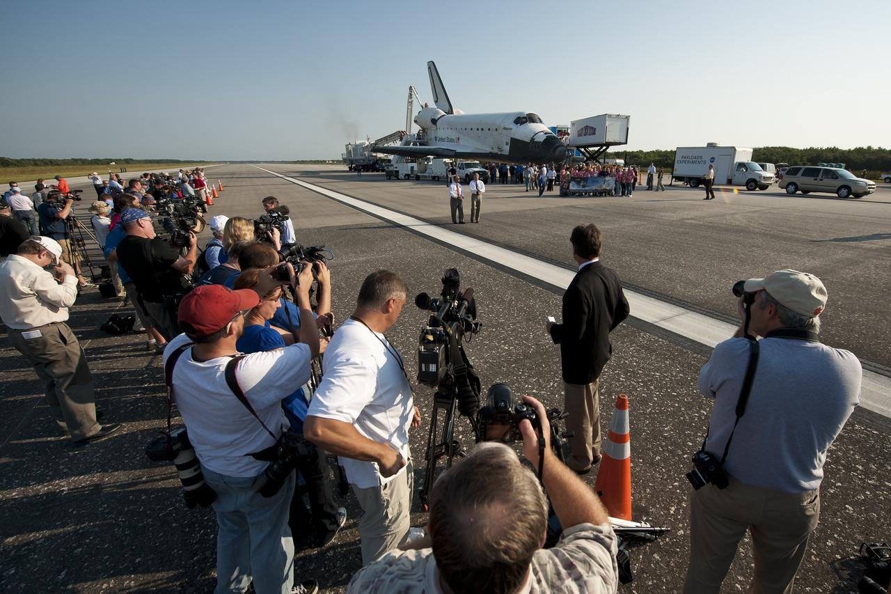 NASA Administrator Charles Bolden, left, and NASA Kennedy Space center Director Robert Cabana walk along the Shuttle Landing Facility (SLF) runway at NASA Kennedy Space Center as members of teh media prepare to ask them questions shortly after the space shuttle Atlantis (STS-135) landed, completing its 13-day mission to the International Space Station (ISS) and the final flight of the Space Shuttle Program, early Thursday morning, July 21, 2011, in Cape Canaveral, Fla. Overall, Atlantis spent 307 days in space and traveled nearly 126 million miles during its 33 flights. Atlantis, the fourth orbiter built, launched on its first mission on Oct. 3, 1985. Photo Credit: (NASA/Bill Ingalls)