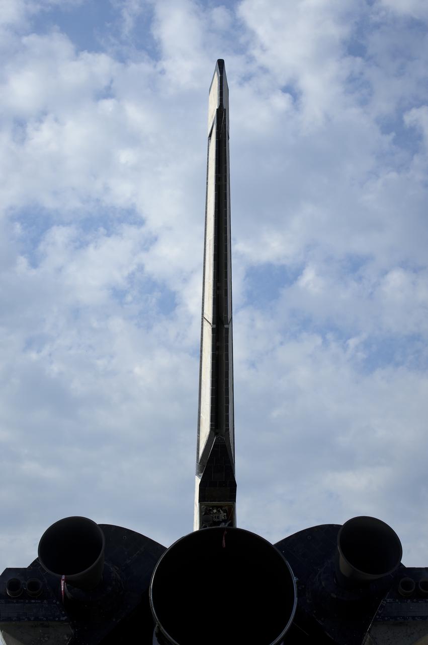 The vertical tail of the space shuttle Atlantis is seen at the Kennedy Space Center Shuttle Landing Facility (SLF) shortly after Atlantis (STS-135) landed early Thursday morning, July 21, 2011, in Cape Canaveral, Fla. Overall, Atlantis spent 307 days in space and traveled nearly 126 million miles during its 33 flights. Atlantis, the fourth orbiter built, launched on its first mission on Oct. 3, 1985. Photo Credit: (NASA/Bill Ingalls)