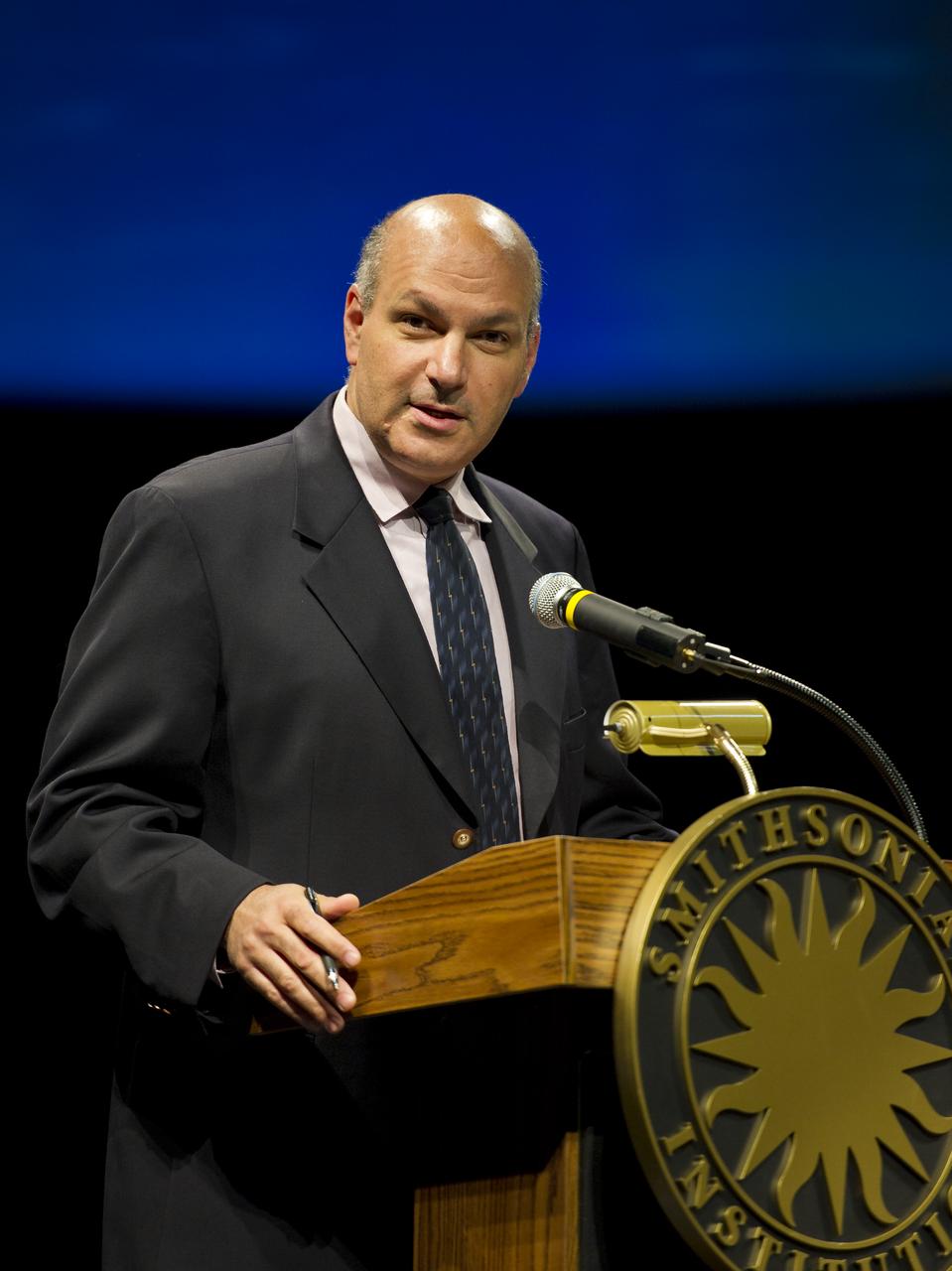 NASA chief scientist, Dr. Waleed Abdalati, speaks at a Mars Science Laboratory (MSL) press conference at the Smithsonian's National Air and Space Museum on Friday, July 22, 2011 in Washington. The Mars Science Laboratory (MSL), or Curiosity, is scheduled to launch late this year from NASA's Kennedy Space Center in Florida and land in August 2012. Curiosity is twice as long and more than five times as heavy as previous Mars rovers. The rover will study whether the landing region at Gale crater had favorable environmental conditions for supporting microbial life and for preserving clues about whether life ever existed. Photo Credit: (NASA/Carla Cioffi)