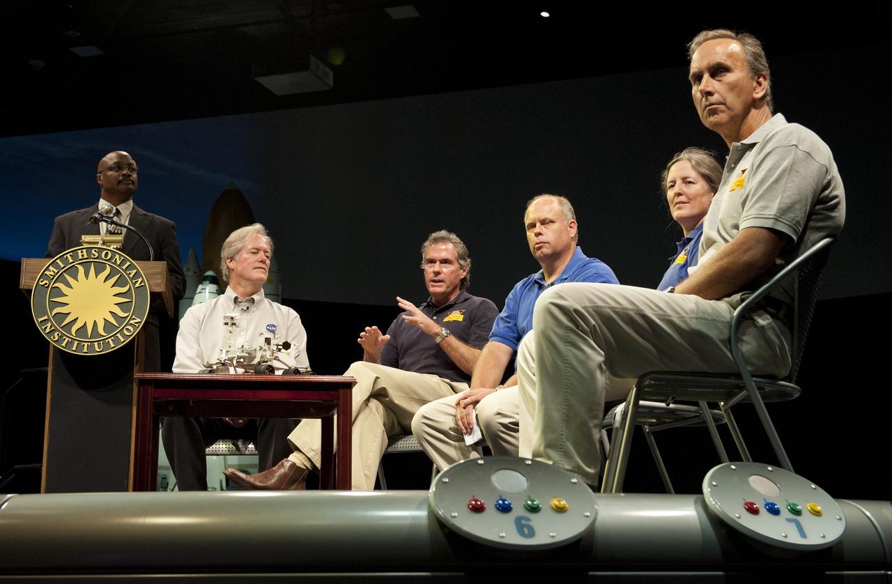 Michael Watkins (third from left), mission manager and project engineer, Mars Science Laboratory (MSL), Jet Propulsion Lab, Pasadena, Calif., speaks at a press conference at the Smithsonian's National Air and Space Museum on Friday, July 22, 2011 in Washington.  From left to right, Watkins is joined by Dwayne Brown, NASA Headquarters public affairs officer; Michael Meyer, lead scientist Mars Exploration Program, NASA Headquarters; Watkins; John Grant, geologist, Smithsonian National Air and Space Museum in Washington; Dawn Sumner, geologist, University of California, Davis and John Grotzinger, MSL project scientist, JPL.  Photo Credit:  (NASA/Carla Cioffi)